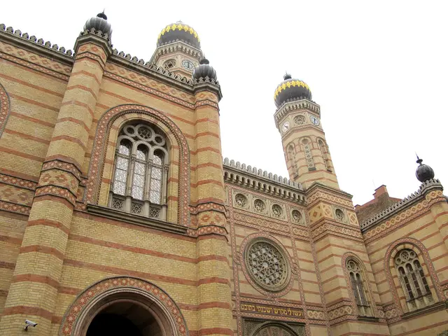 Striped brick walls and onion-domed tower of the Dohány Street Synagogue