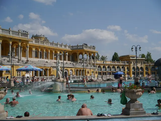 Bathers in the outdoor pools beneath the colonnades of the Széchenyi Thermal Bath