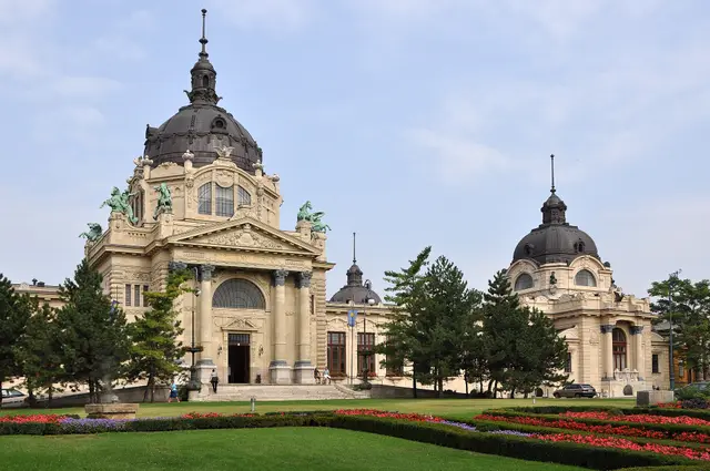 The yellow neo-Baroque domes and gardens of the Széchenyi Thermal Bath in City Park